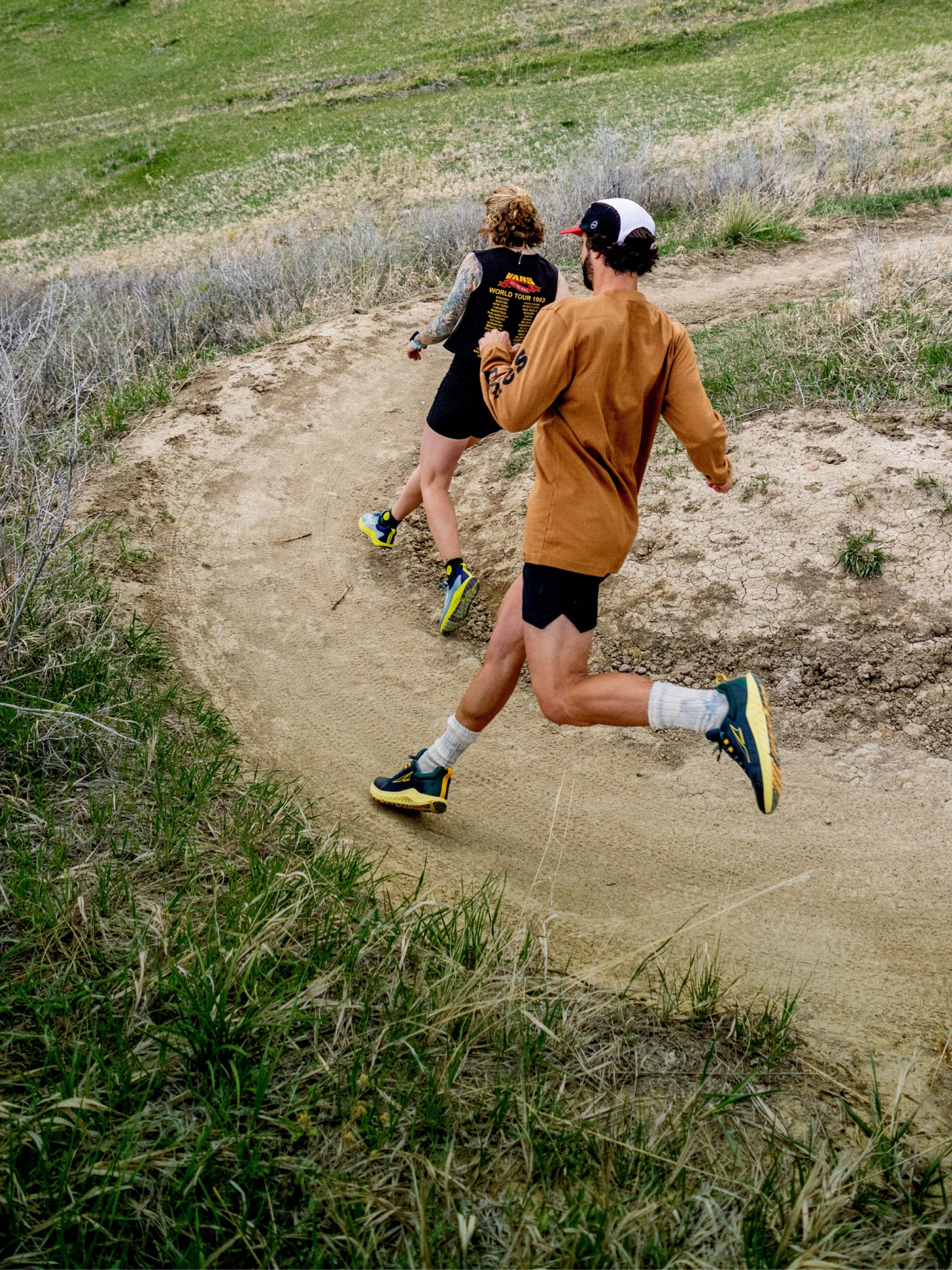 Trail runners rounding a corner.