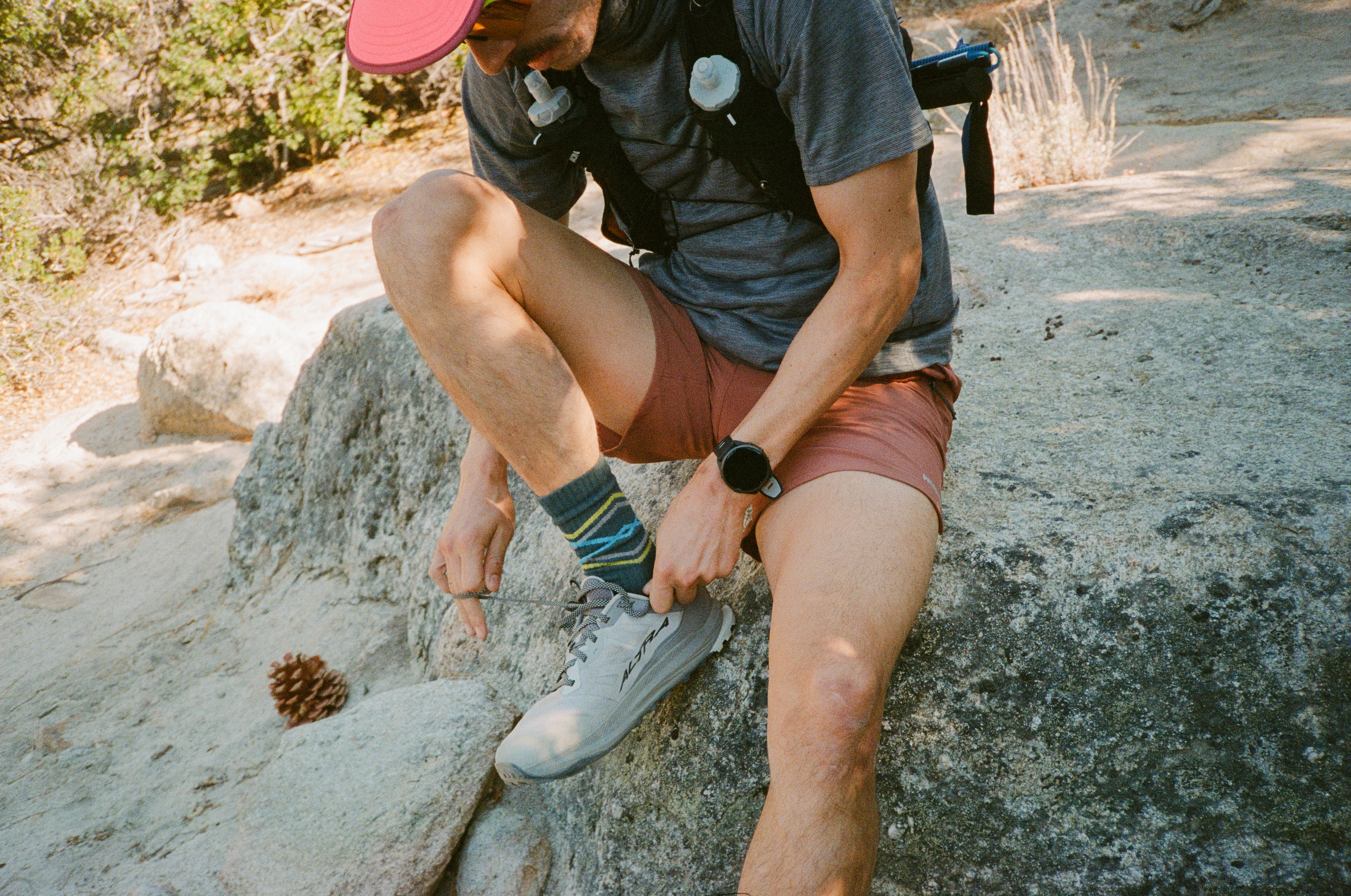 A trail runner wearing a GPS watch