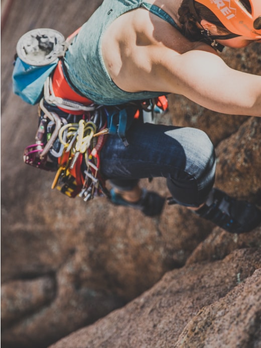 A climber ascending a rock face.