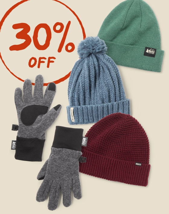 R E I Co-op brand beanies and gloves. Text reads, up to 30% off.