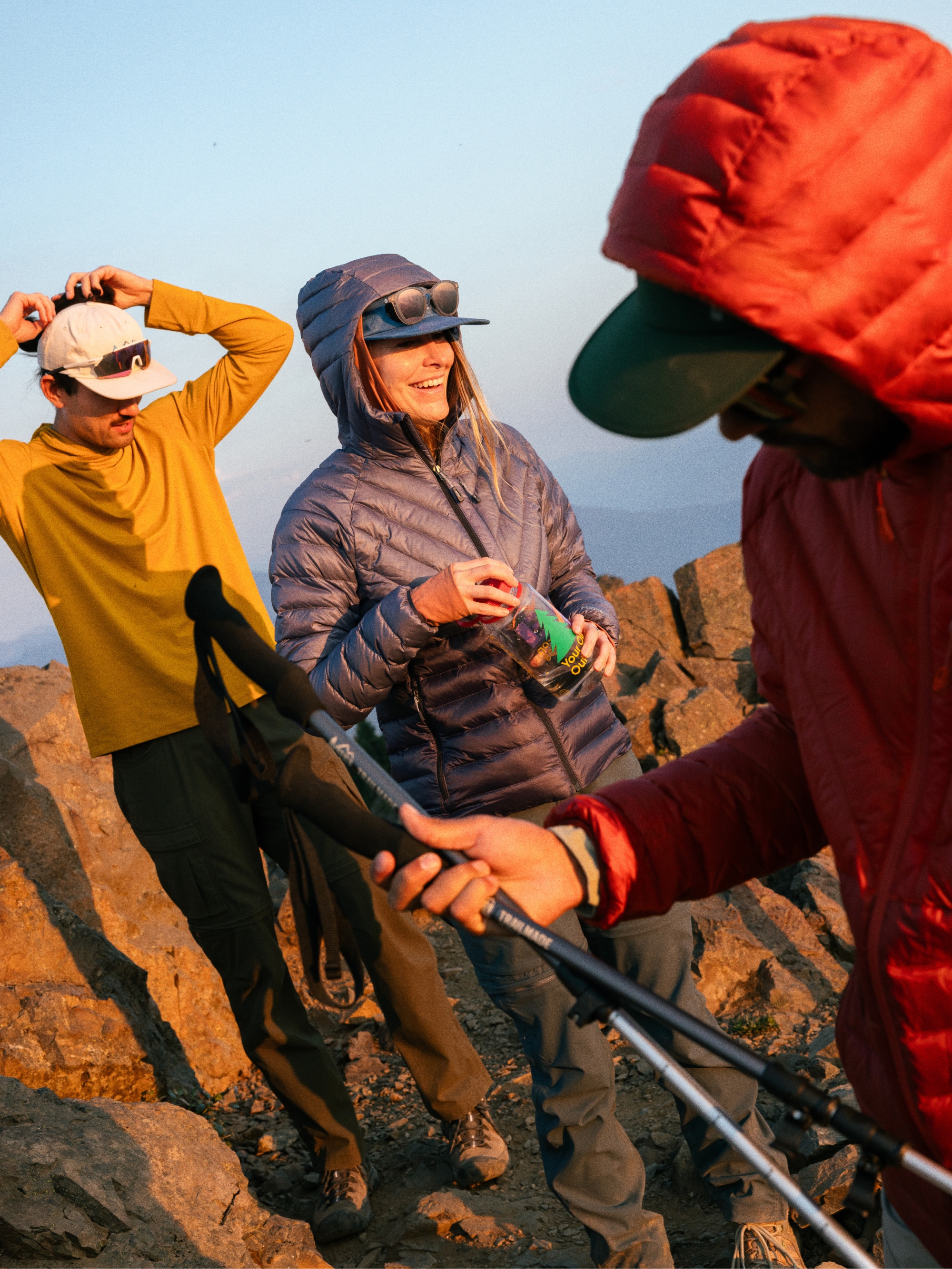 A group of people enjoying a hike in R E I Co-op gear.