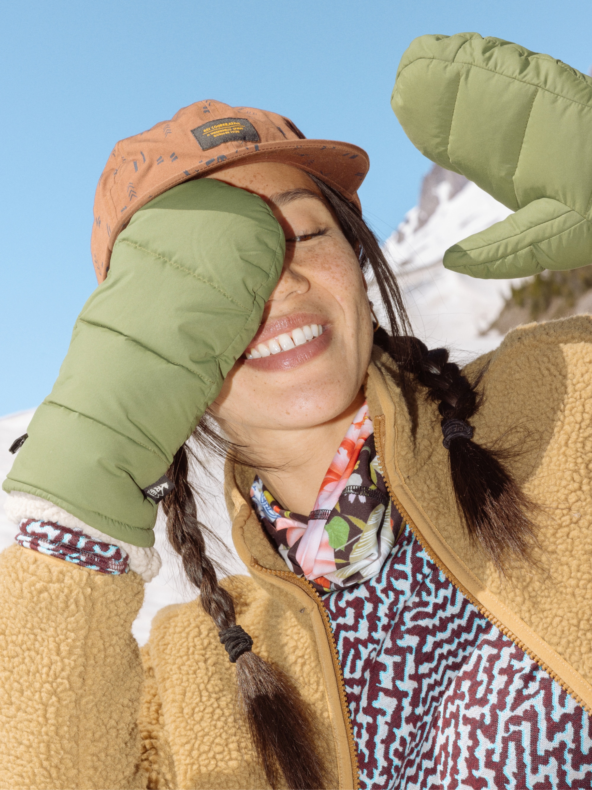 A person poses for a photo while bundled up in winter gear.