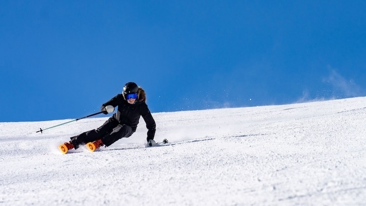 A woman skis a groomer on Blizzard's Black Pearl skis.