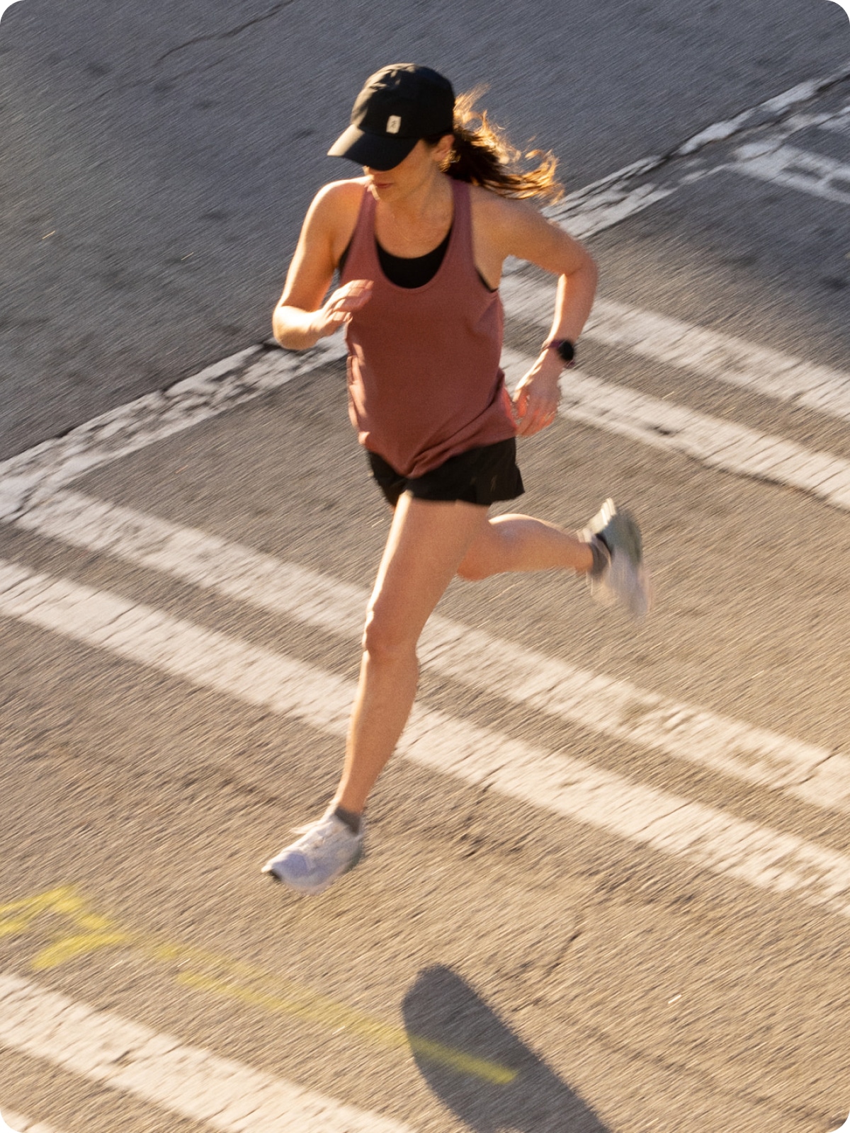 A person running across a crosswalk.