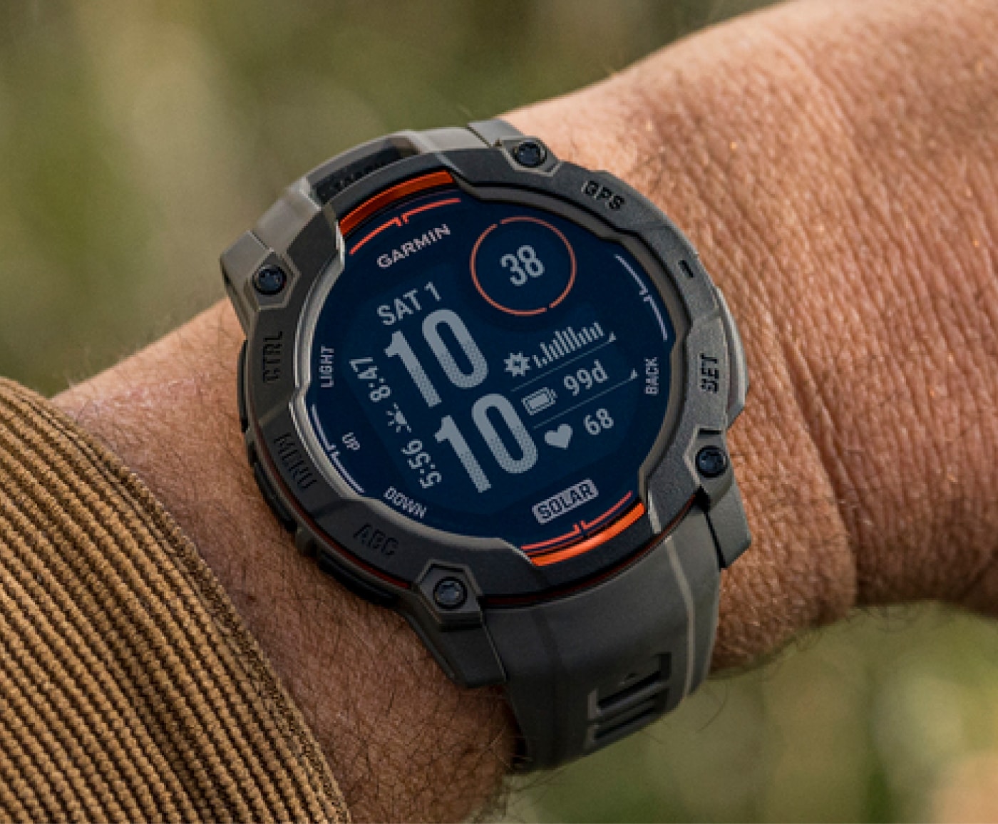 The Garmin Instinct 3 Solar being worn on a person's wrist.