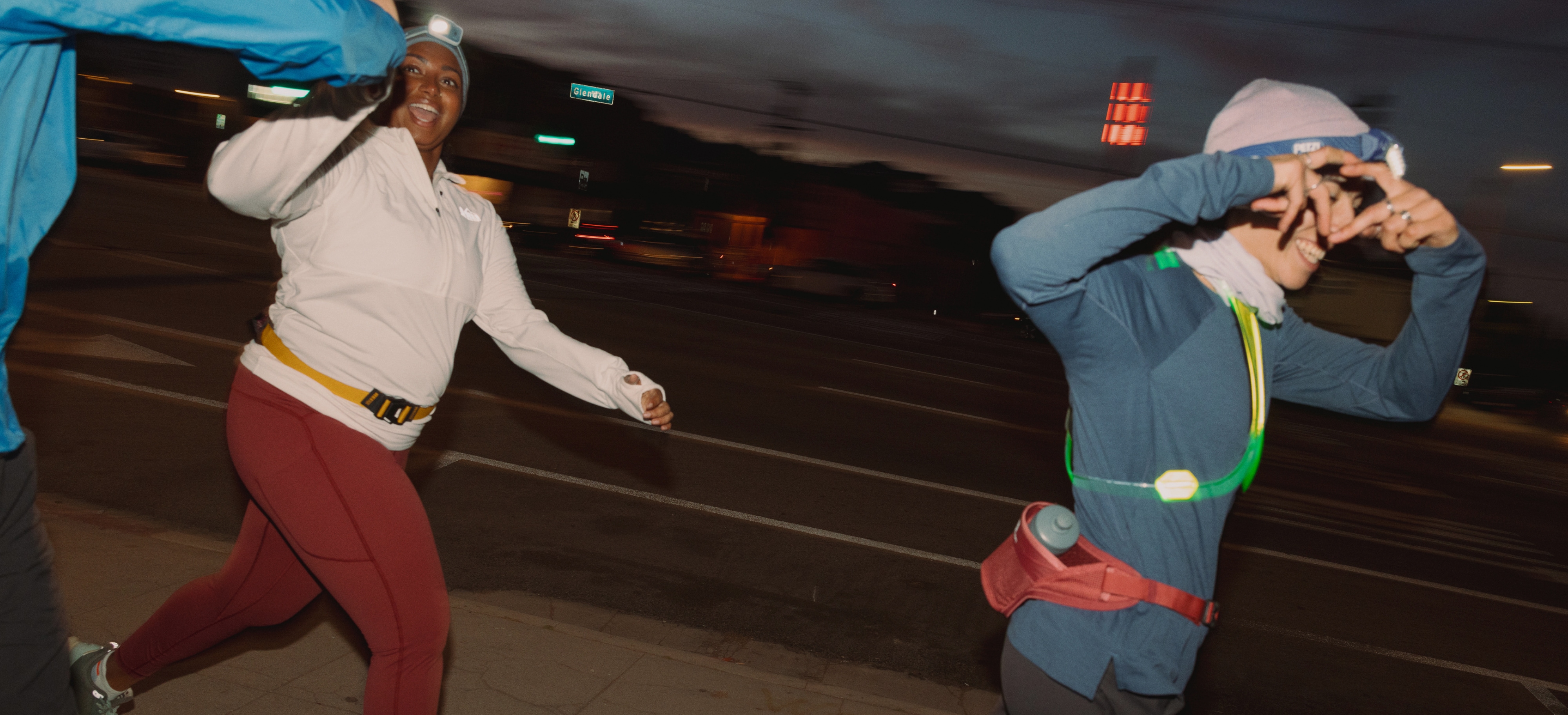 Three people on an evening run together.