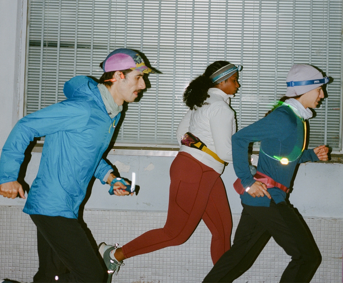 A trio of people running together