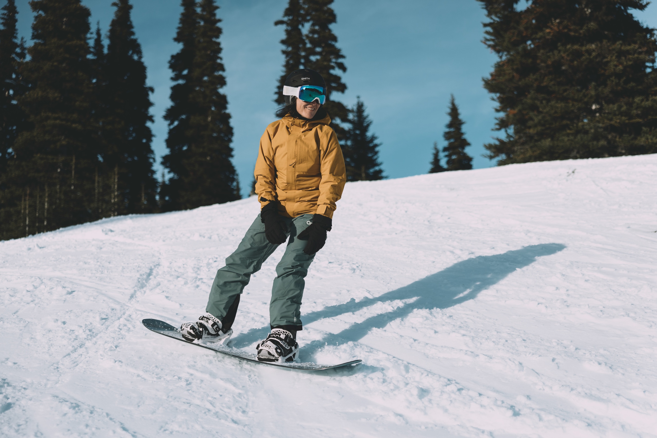 A person snowboards on a slope.