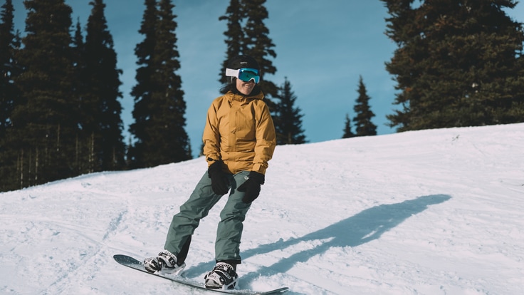 A person snowboards on a slope.