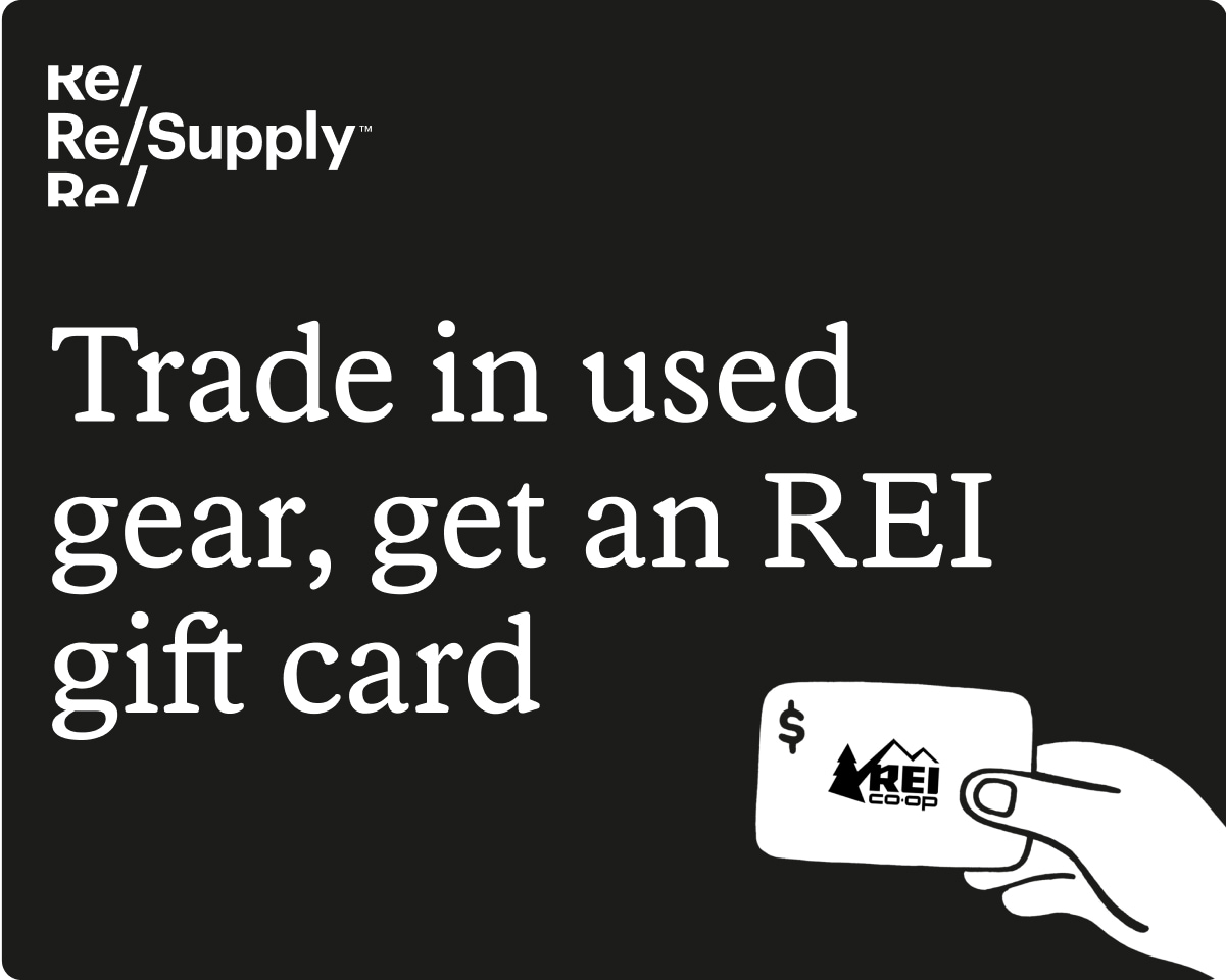 Re/Supply. A hand holding an R E I gift card.