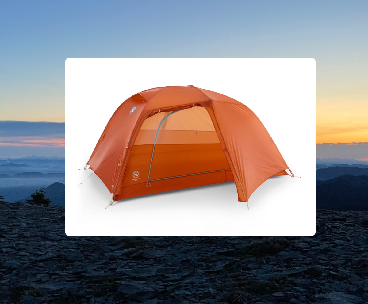 The Big Agnes Copper Spur UL2 tent over an image of a sunset.