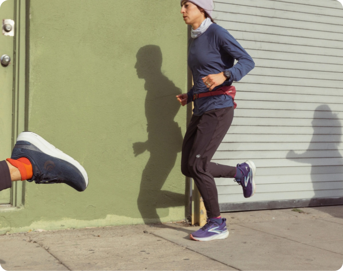 A person runs along the sidewalk.