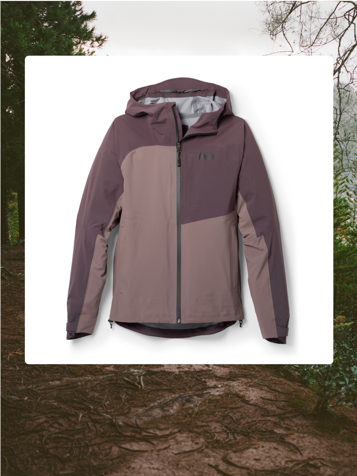 The R E I Co-op XeroCloud 3L jacket over an image of a trail.