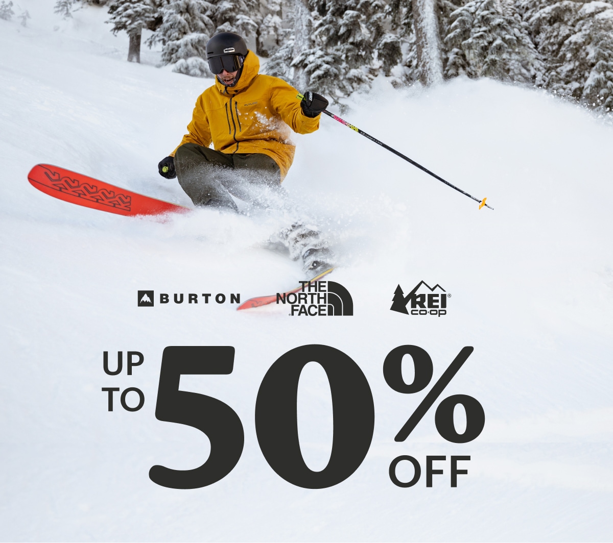 Burton. The North Face. R E I Co-op. Up to 50 percent off. A person skis down a snowy mountain.