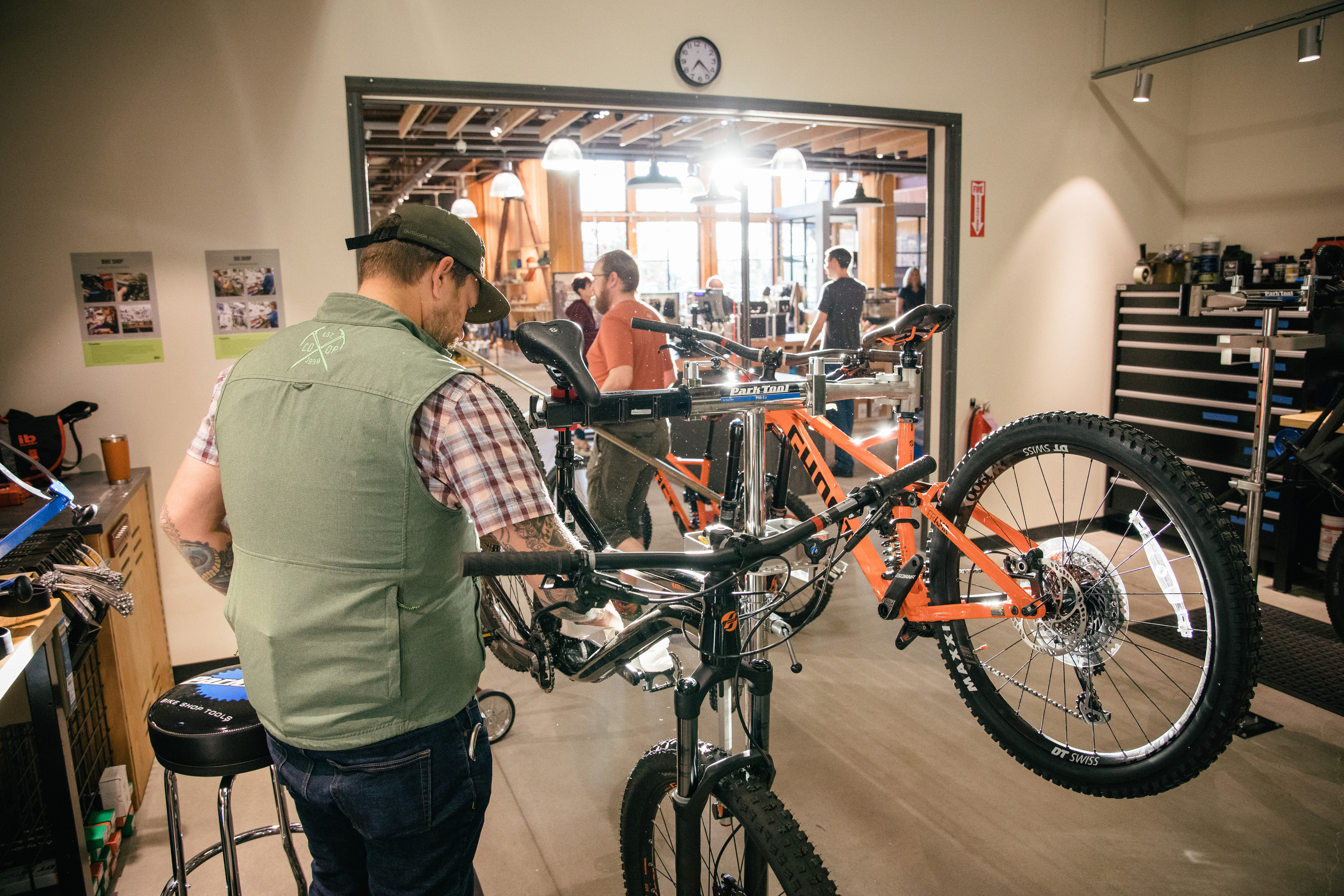 A bike specialist doing some adjustments to a bike