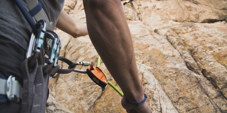 climber belaying using a grigri belay device