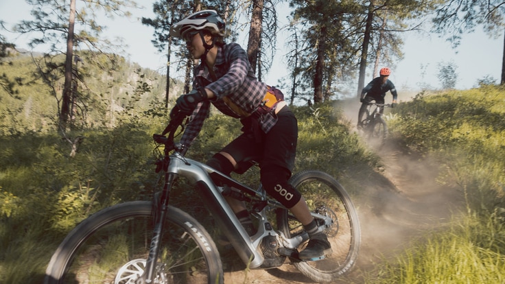 two mountain bikers on a ridge