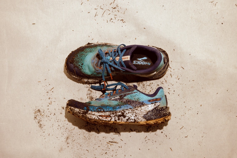 A well-loved pair of dirty Brooks Catamount shoes