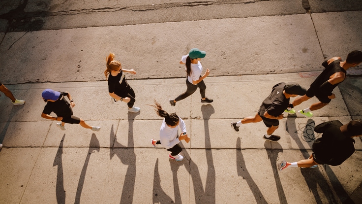 Running group makes their way down the sidewalk