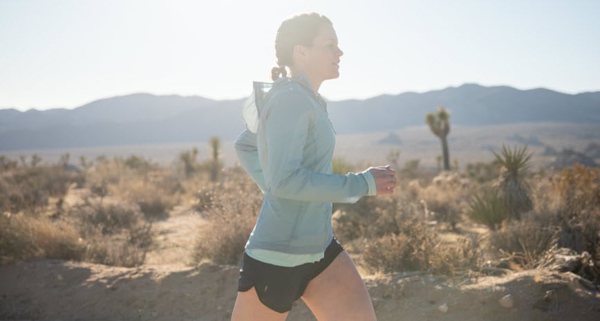 Woman running in desert