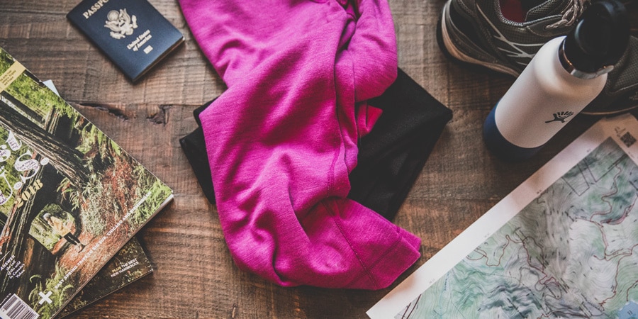 the items a traveler needs to prepare for a trip, including a map, passport, and travel guides