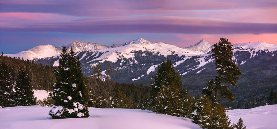 Snowy mountains at sunrise.