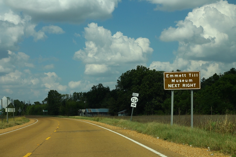 A road sign for the Emmett Till Museum.