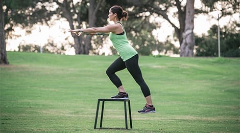 Performing an exaggerated step-down in a park