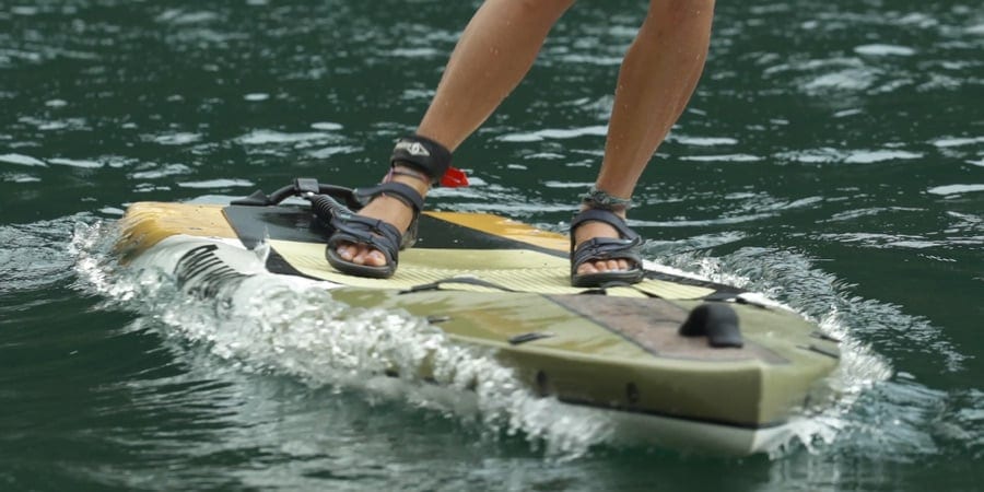 a kayaker falling away from their board