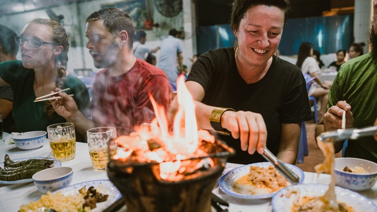 travelers enjoying a shared meal