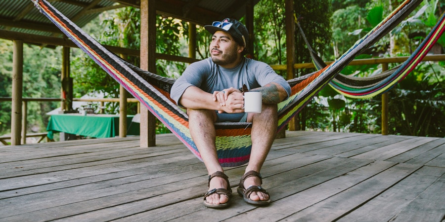 a traveler relaxing in a hammock