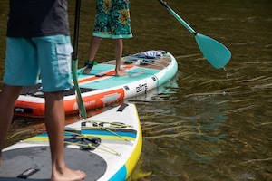 Two men on stand up paddle boards