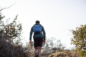 A hiker trekking on a trail