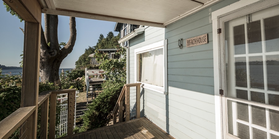 A beach house with a porch