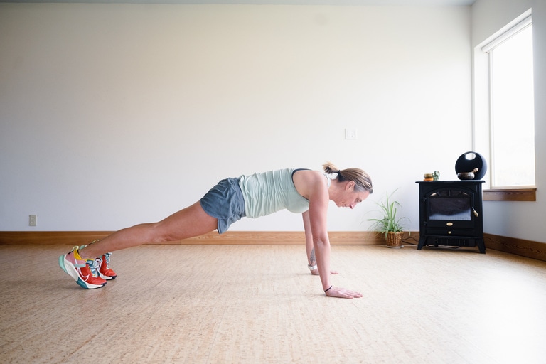 A woman performs a plank