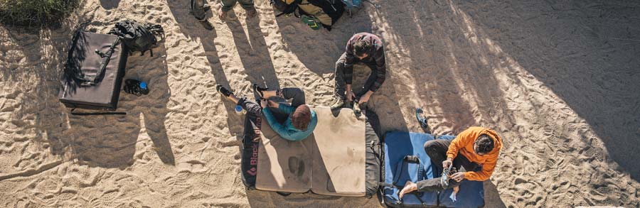 Climbers gearing up for bouldering in a southwest desert