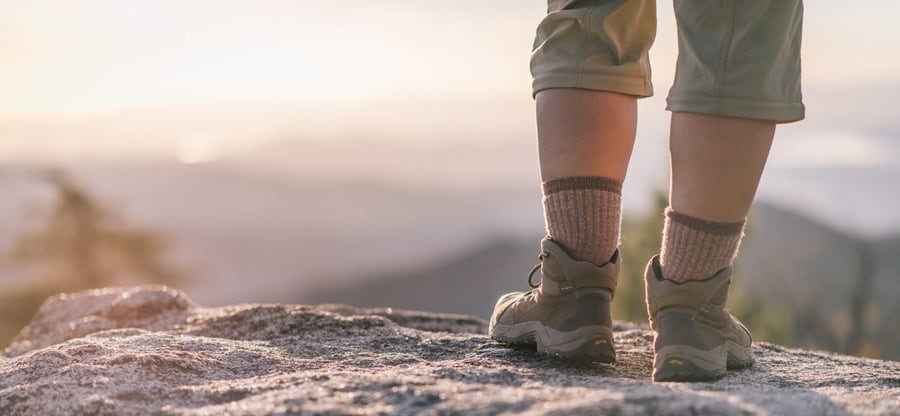 a backpackers boots on the trail