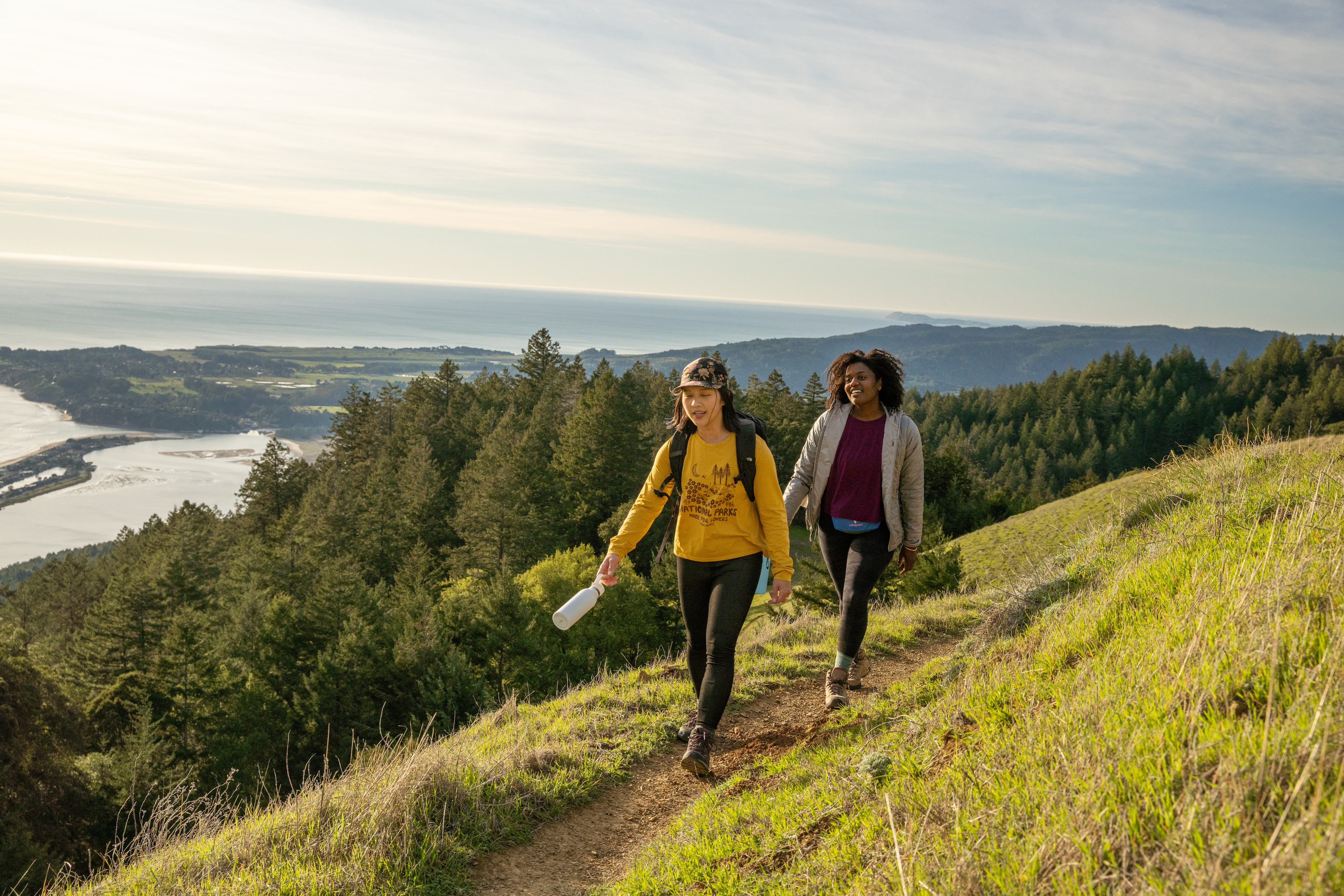 Two hikers enjoying a hike in the foothills.