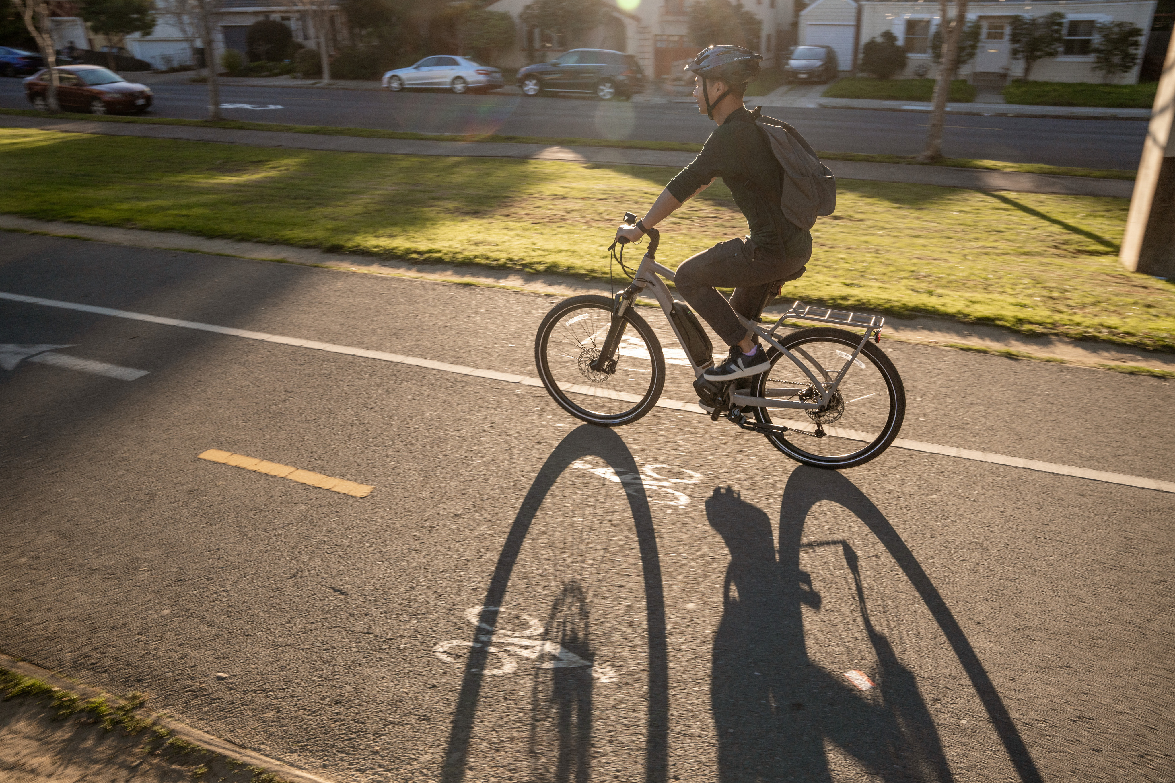 Cruising through a residential neighborhood on an e-bike during a morning commute