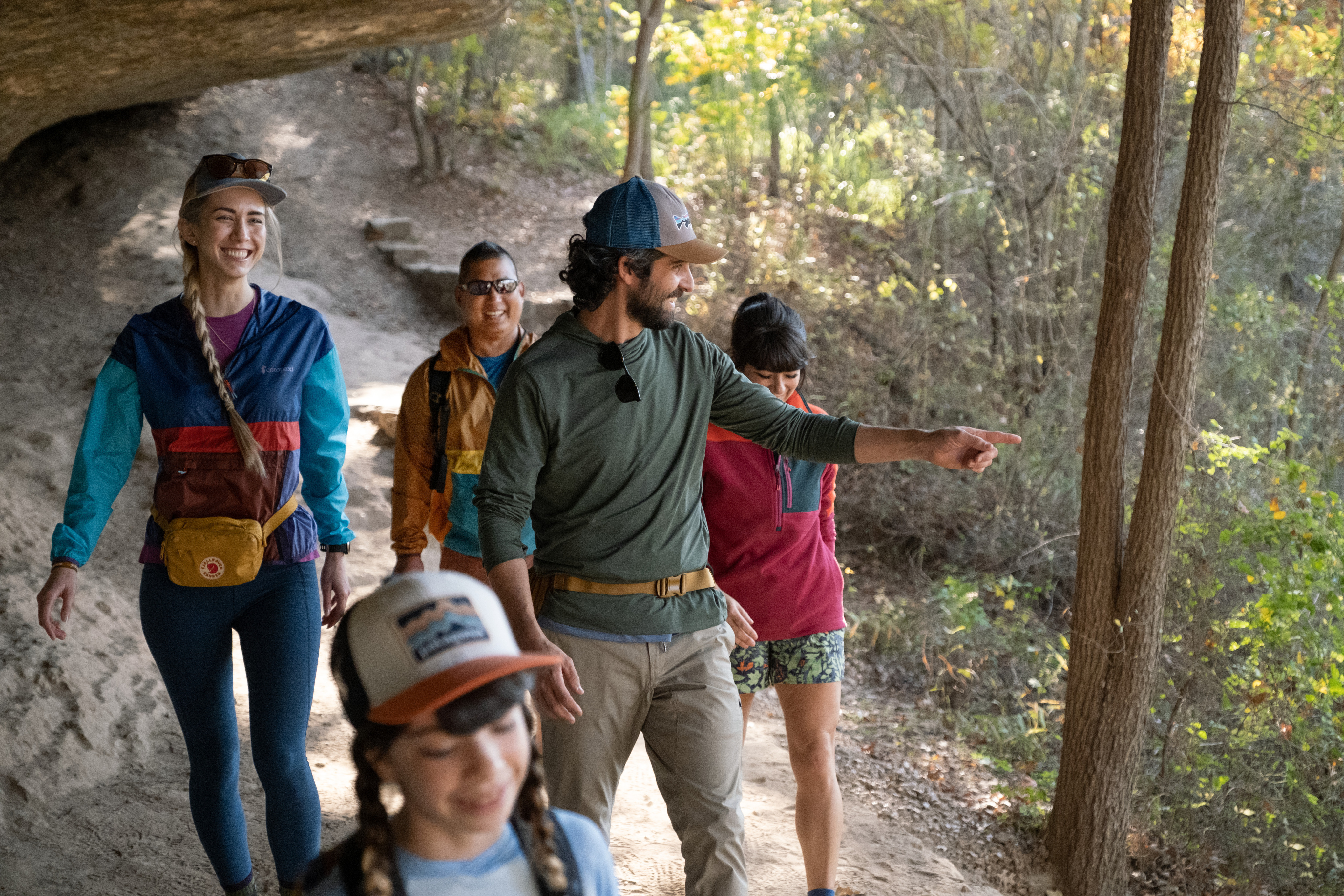 A group of people of all ages hiking together