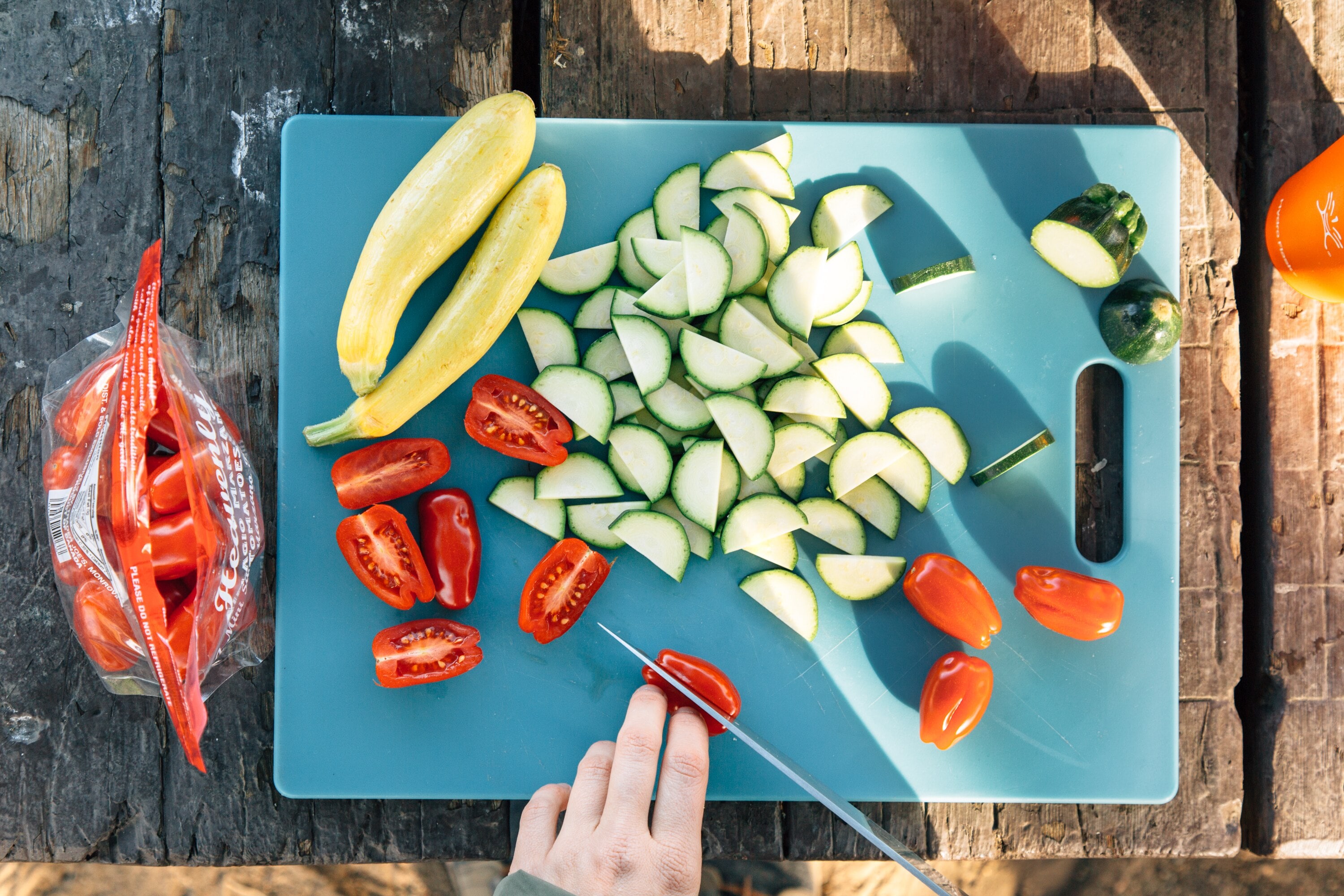 Slicing tomatoes on a cutting board