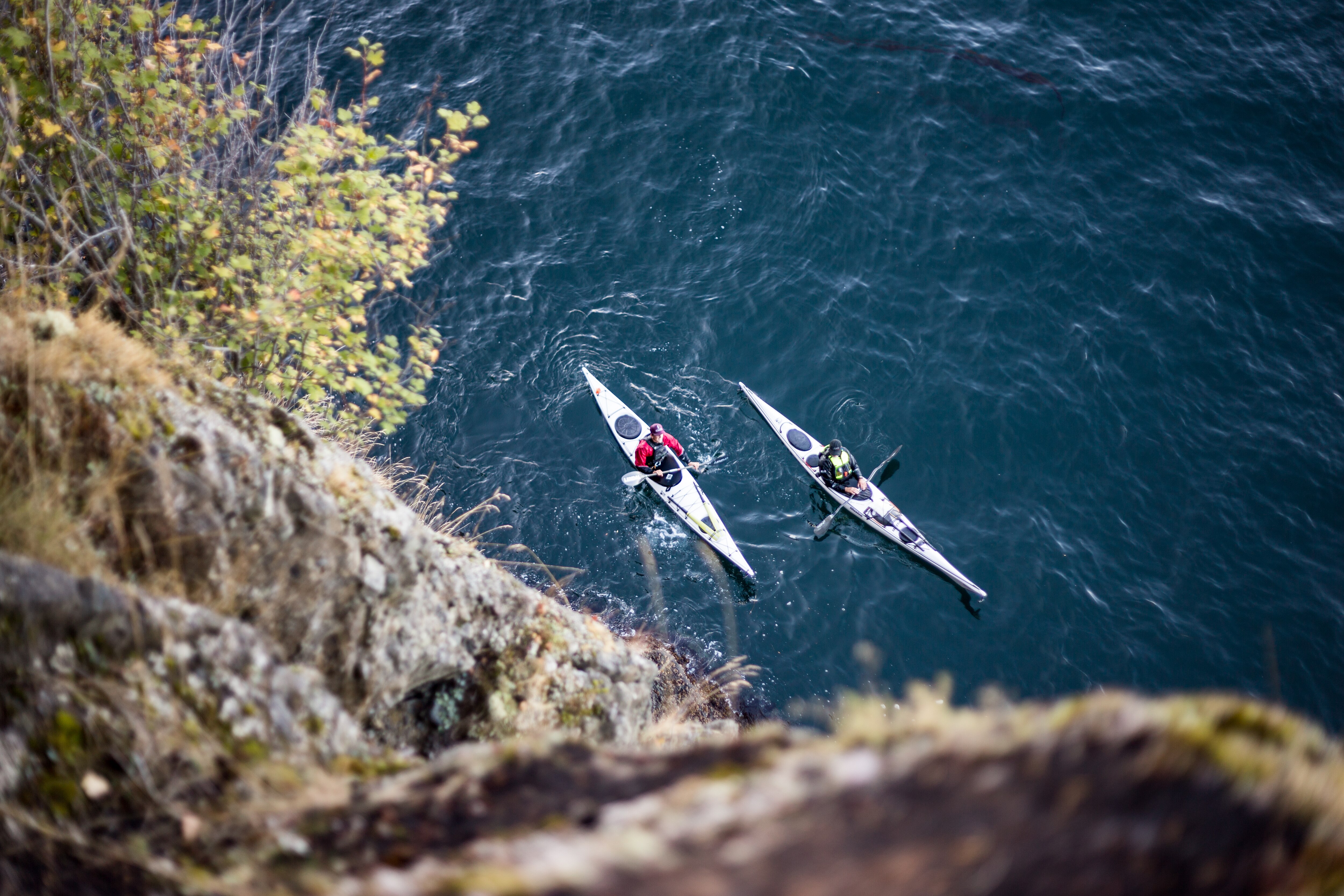 Two Kayakers in a cove