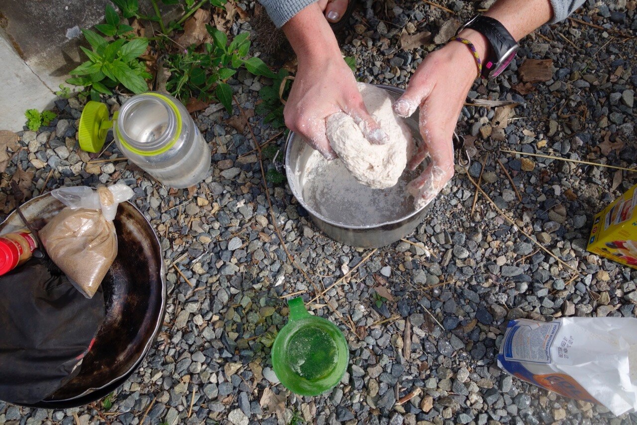 Catherine kneads the dough.