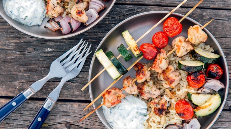 Chicken, tomatoes and zucchini on a skewer.