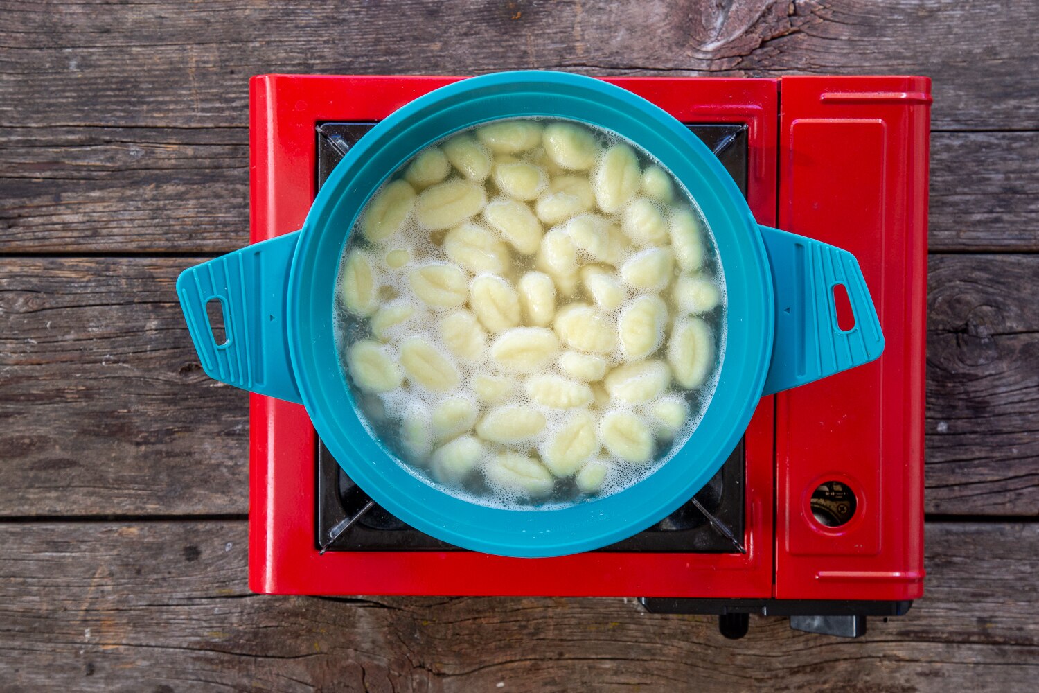 Gnocchi boiling in water in Sea to Summit backpacking bowl