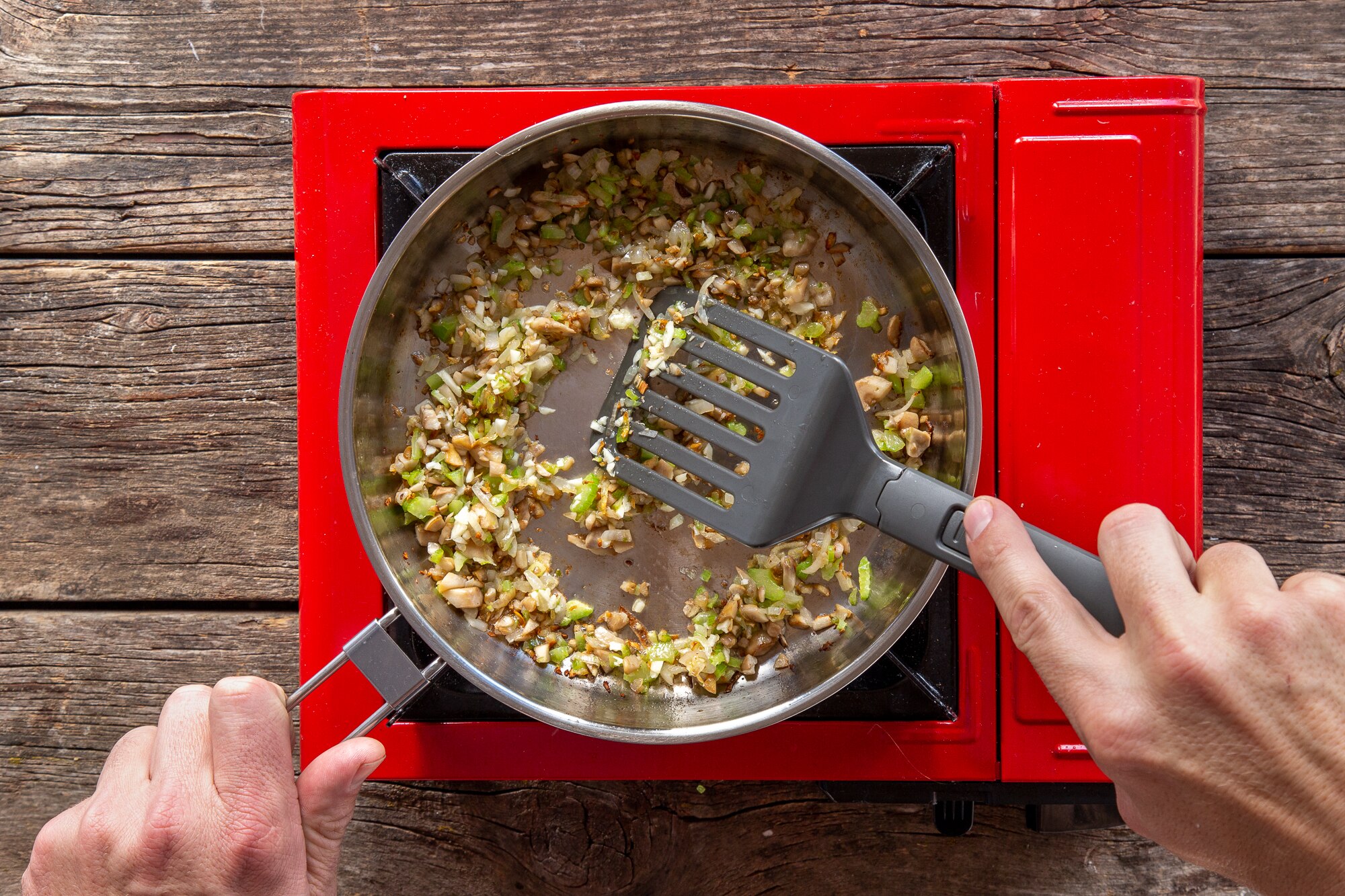 Stirring ingredients in pan for stuffed mushrooms