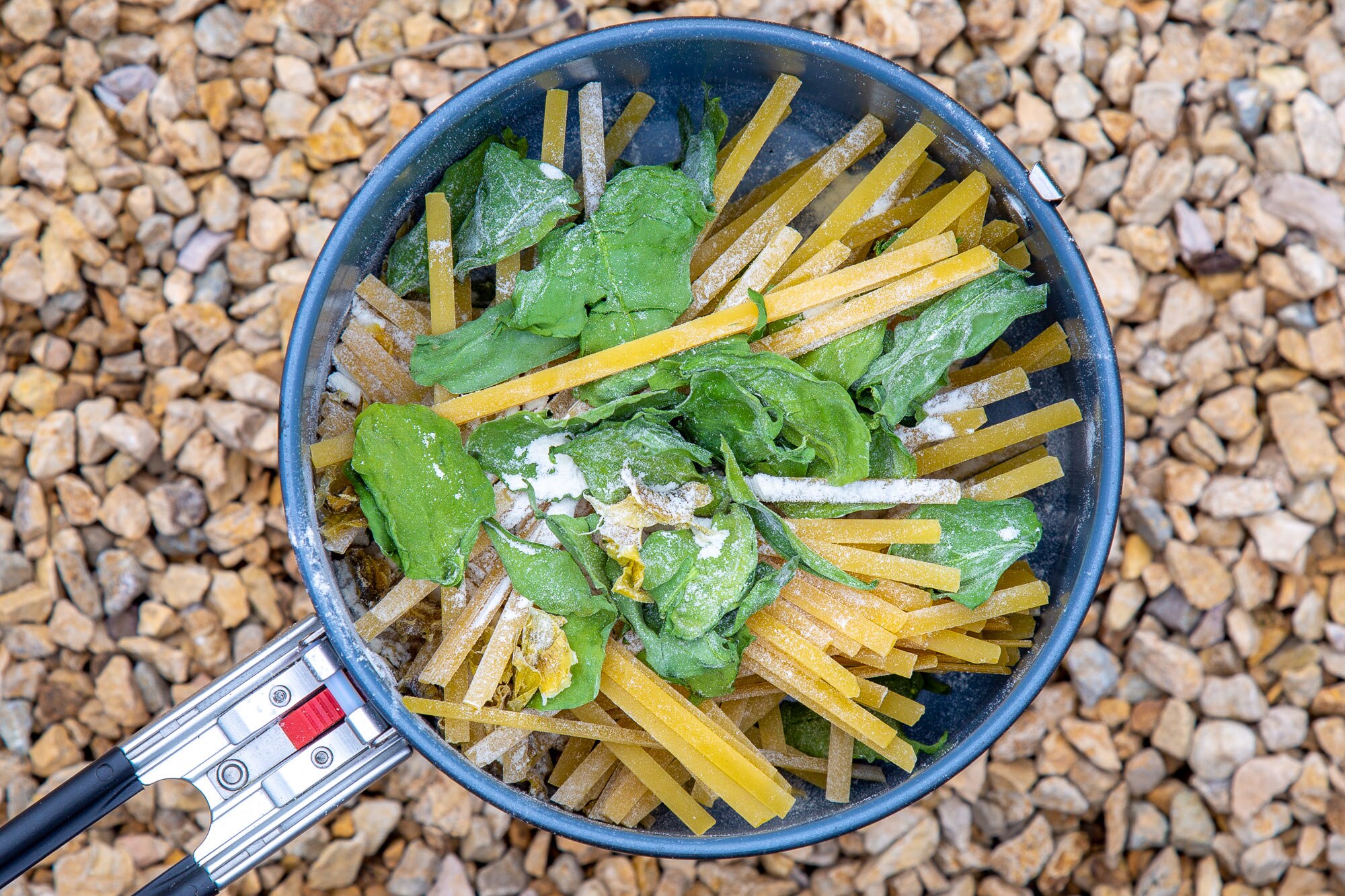 All ingredients for backpacking spinach artichoke fettuccine alfredo in pot