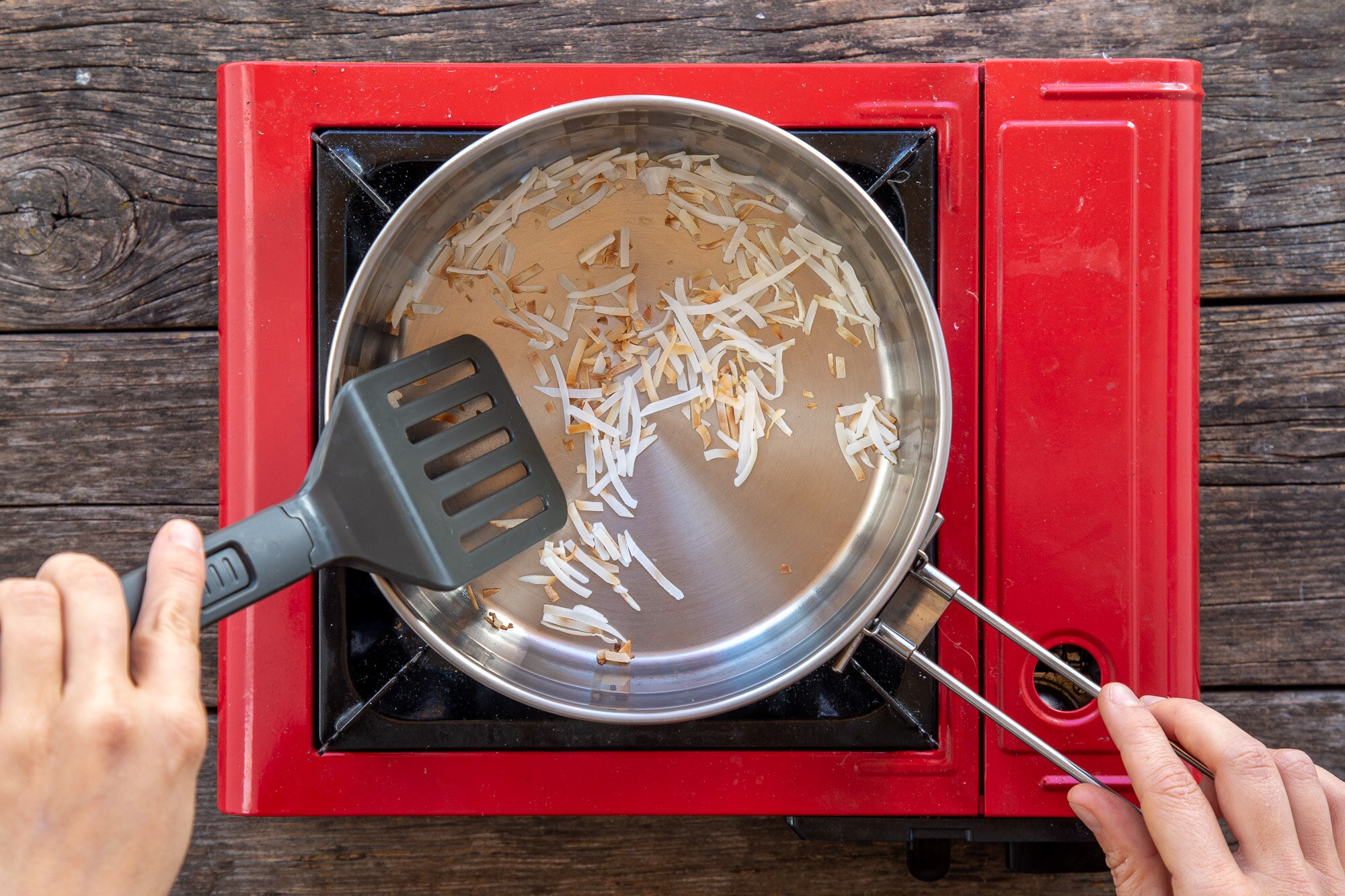 Coconut toasting in a pot