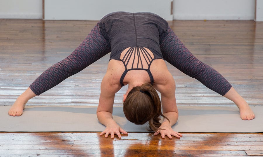 standing straddle forward fold yoga pose