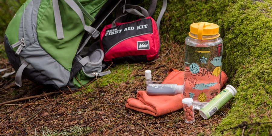 a first aid and supplies spread on the ground